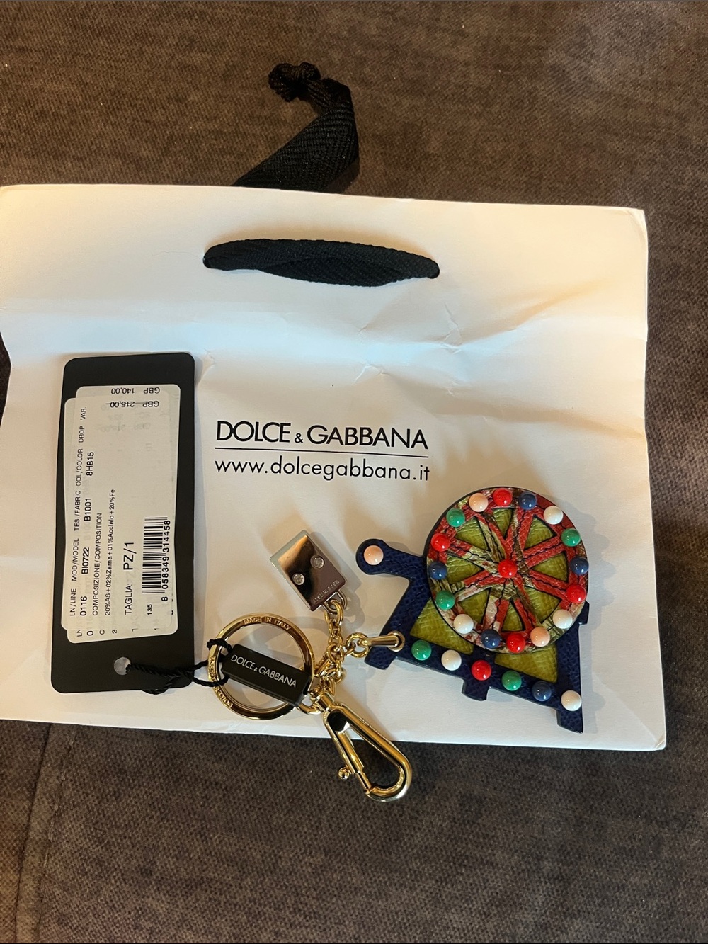 NWT Dolce & Gabbana Carretto keychain, featuring a colorful carousel motif.
